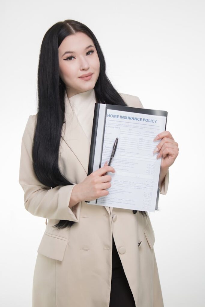 Professional businesswoman presenting a home insurance policy with confidence.